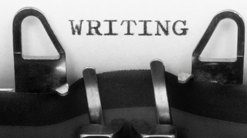 a typewriter portraying the act of writing